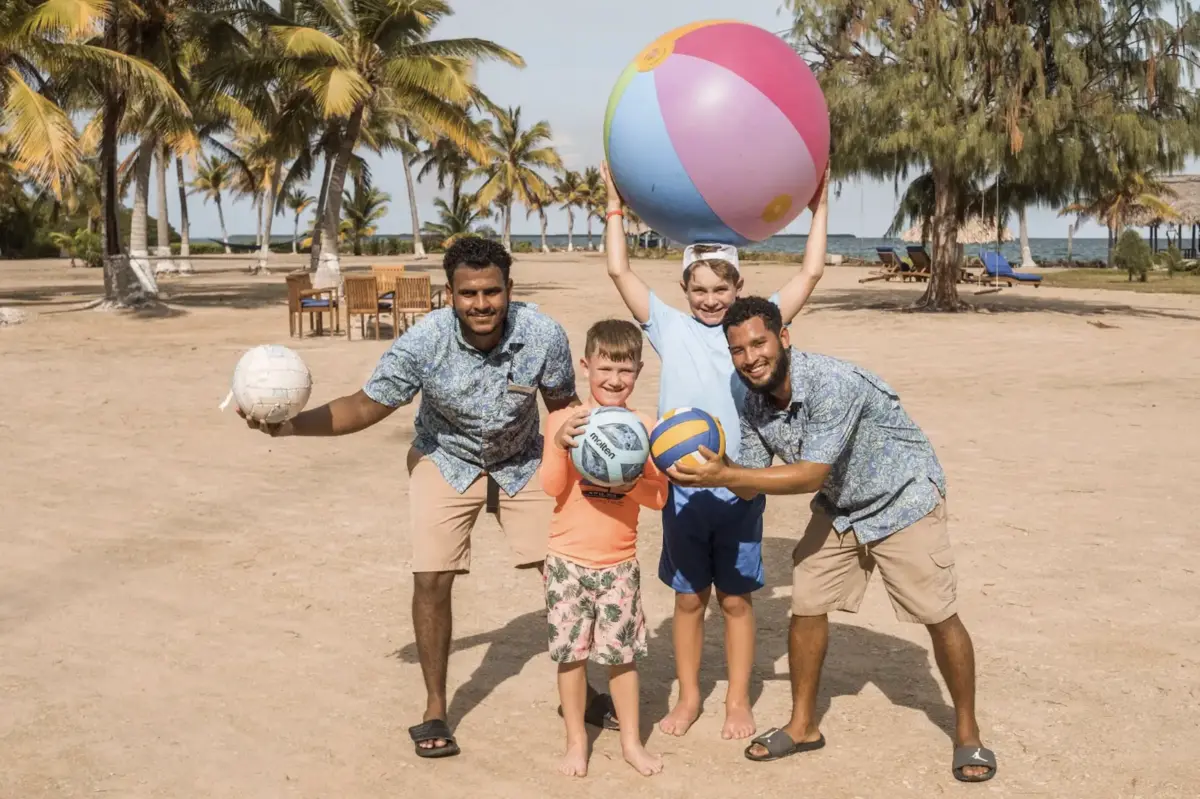 Kids Playing Volleyball with Royal Belize Team - MuyOno Resorts
