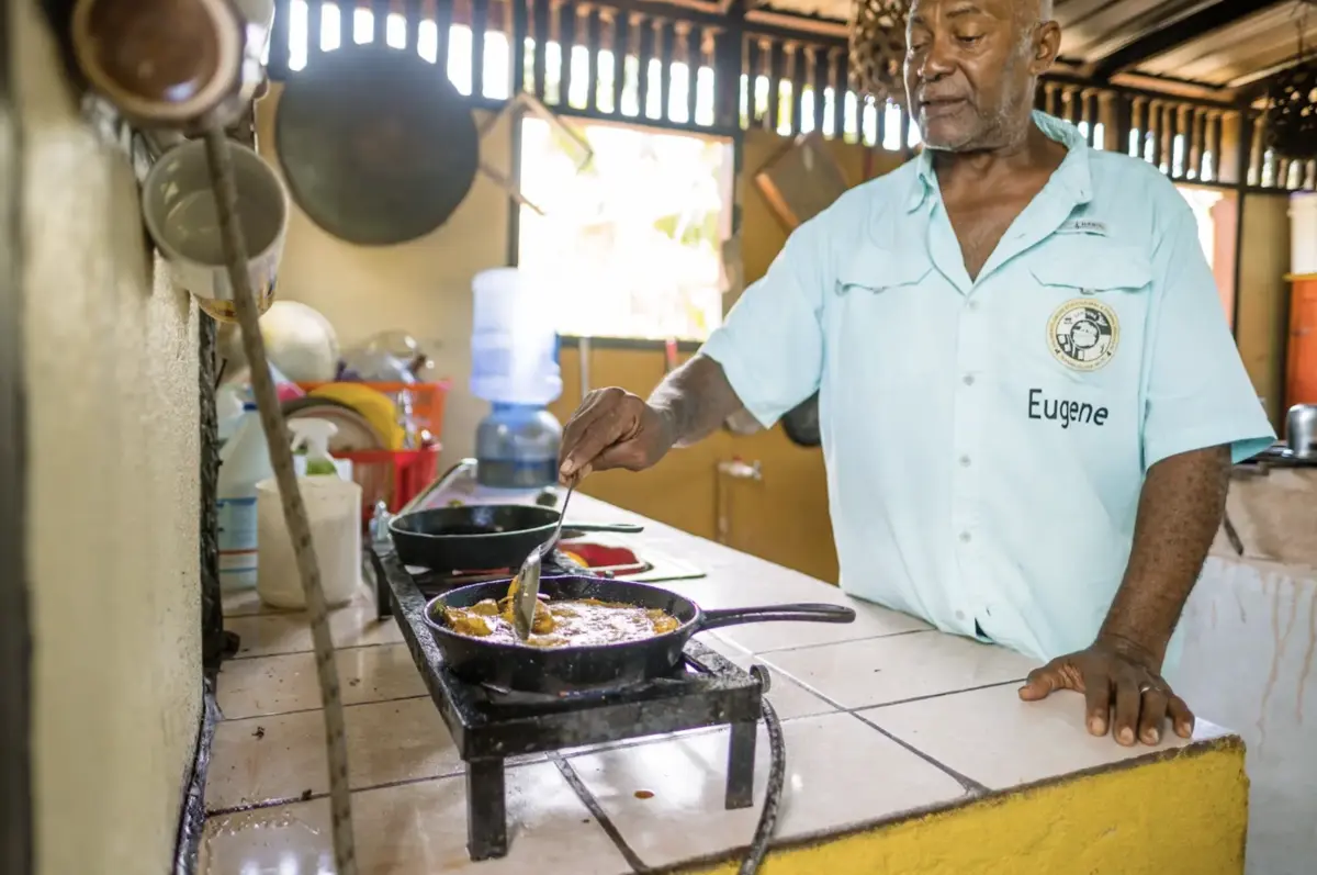 Chef Cooking A Traditional Garifuna Meal in Hopkins Village Belize - MuyOno Resorts