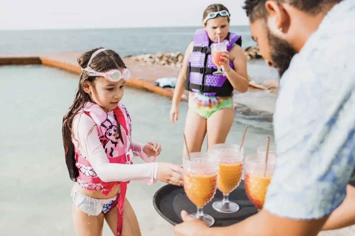 Kids Enjoying Frozen Slushies at Royal Belize - MuyOno Resorts